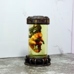 Intense 'D-Rex Breaks Containment' artwork featuring a terrifying dinosaur escaping a futuristic laboratory.