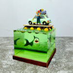 Finished 'Shark Alert' DIY epoxy resin shark diorama kit by AmazingTrungX, showing a raft above a menacing shark.