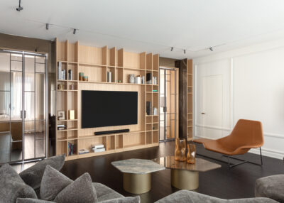 A stylish living room featuring a mix of ambient, task, and accent lighting from top lamp brands.