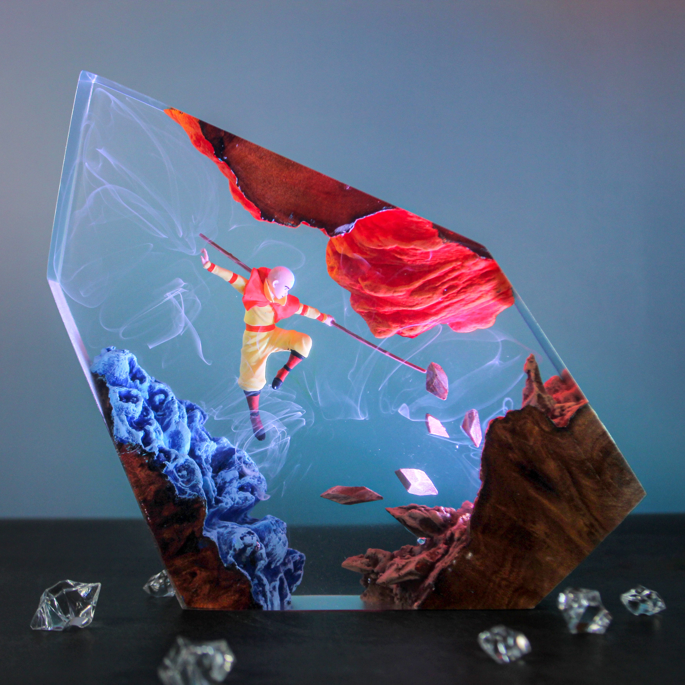 IMG_9521 Aang elemental resin lamp, depicting Aang amidst the four elements: air, water, earth, and fire, glowing from within a clear resin block.